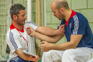 Ian Johns, Head Paralympic Coach, works with Sam Ingram between fights at GB VI Grand Prix