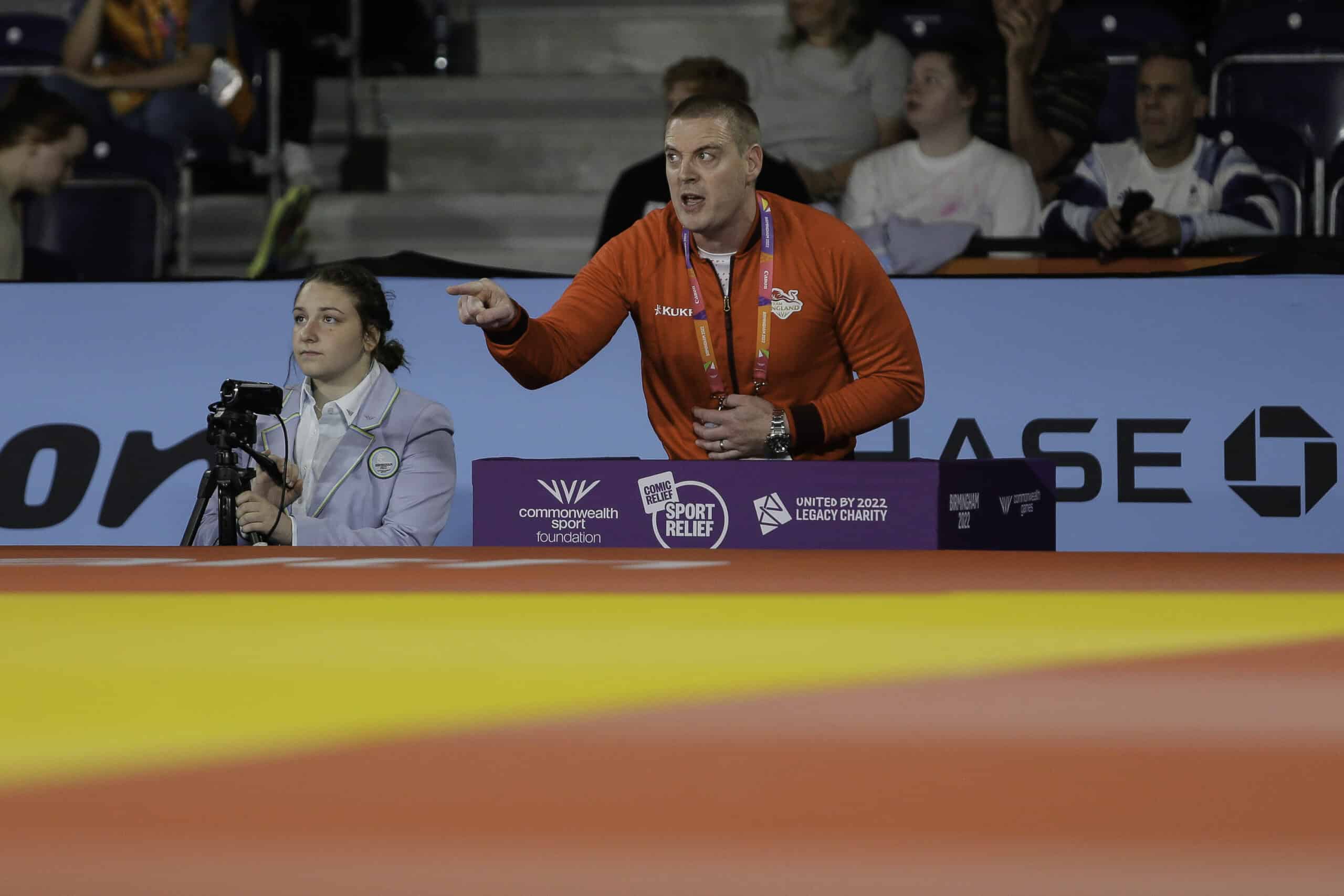 England Judo Coach in their Coaching Box at the 2022 Commonwealth Games