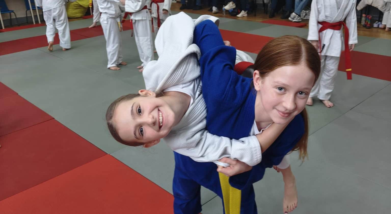 Two female judoka grappling
